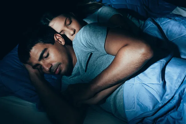 photo of couple sleeping