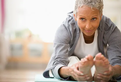 https://img.webmd.com/dtmcms/live/webmd/consumer_assets/site_images/articles/health_tools/cholesterol_overview_slideshow/getty_rm_photo_of_woman_stretching.jpg