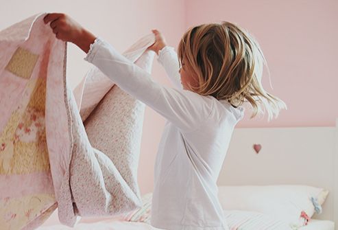 girl making bed