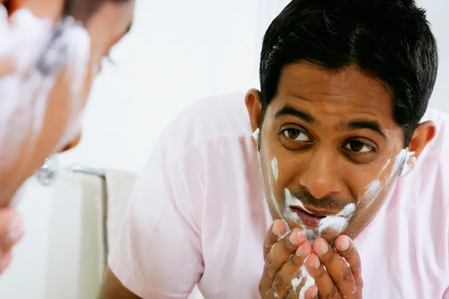 photo of man washing face