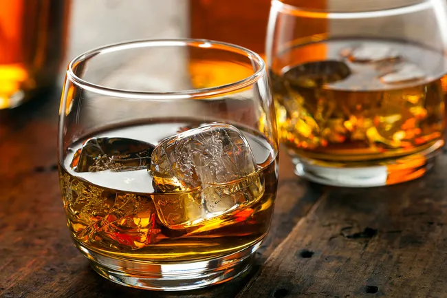 photo of glasses of bourbon on ice