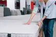 photo of person buying new mattress