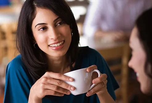 woman having coffee with her friend