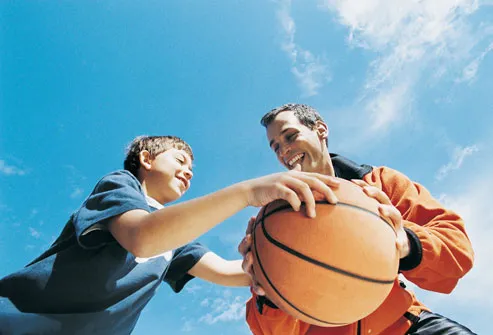 Father And Son Playing Basketball