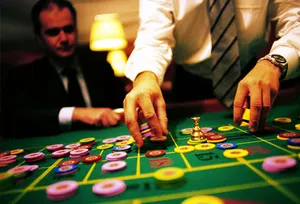Man and dealer with gambling chips