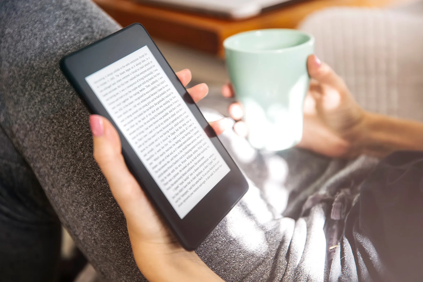 photo of woman using e reader