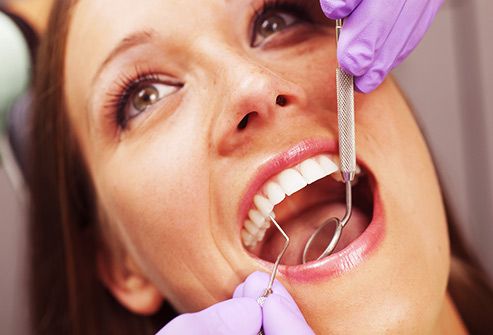 woman having teeth cleaned
