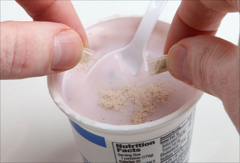 Putting probiotic capsule into yogurt