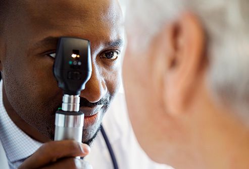 senior patient receiving eye exam