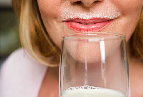 Close up of mature woman with milk mustache