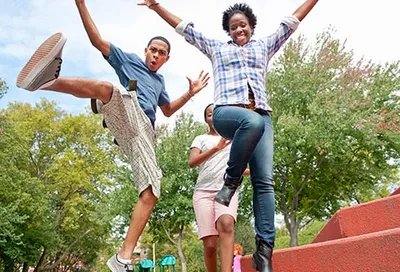 teens jumping in park