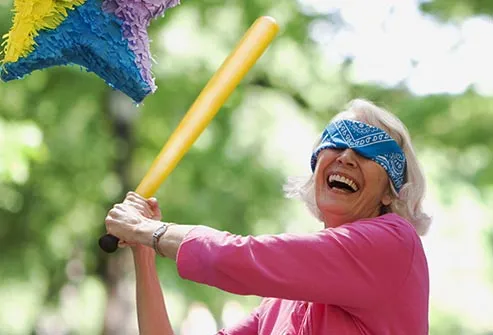 blindfolded woman and pinata