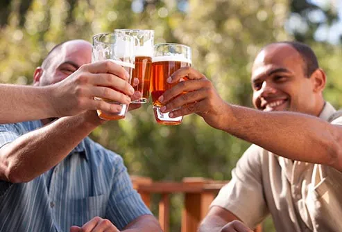 men toasting with beer