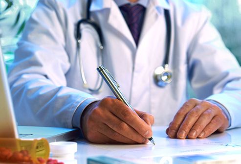 doctor writing prescription