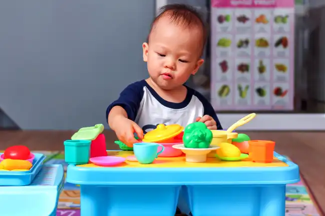 toddler playing with toys