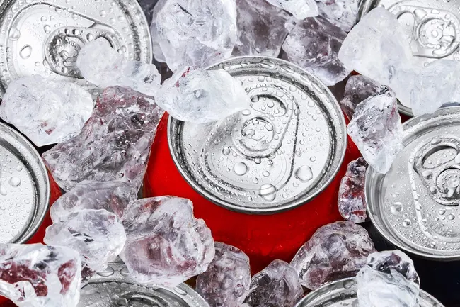 photo of cans of soda on ice