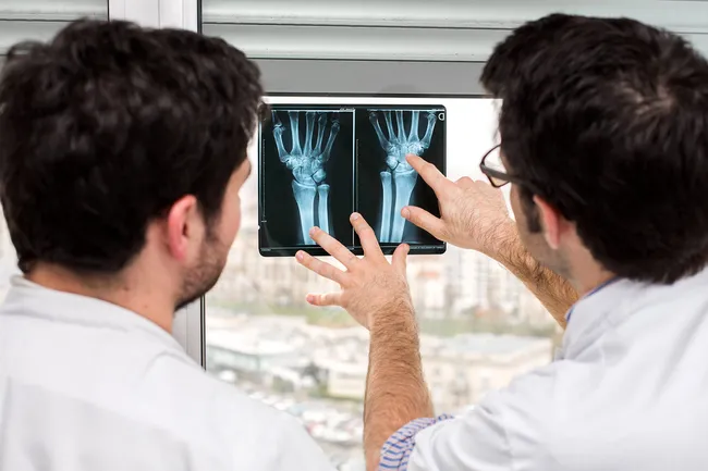 doctor and patient examining xrays