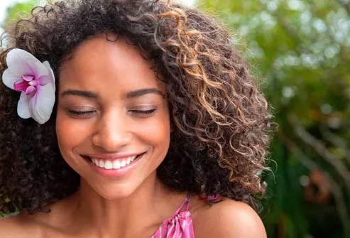 smiling woman with curly hair