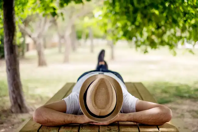 man napping on bench
