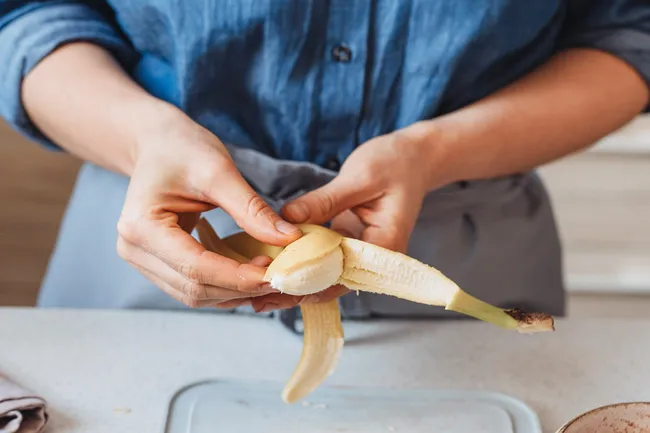 photo of peeling banana