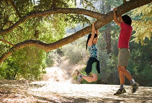 couple hanging from tree