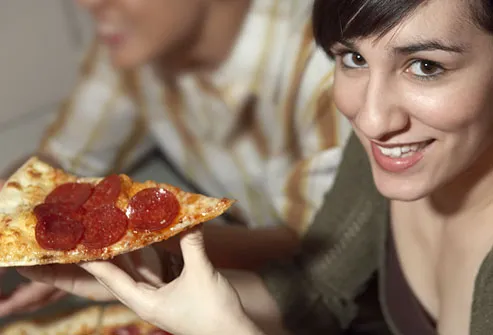wodka na wesele - photolibrary rf photo of woman eating pizza