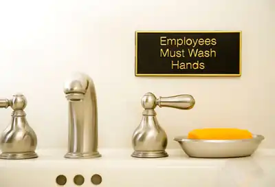 Hand Wash Sign in Bathroom
