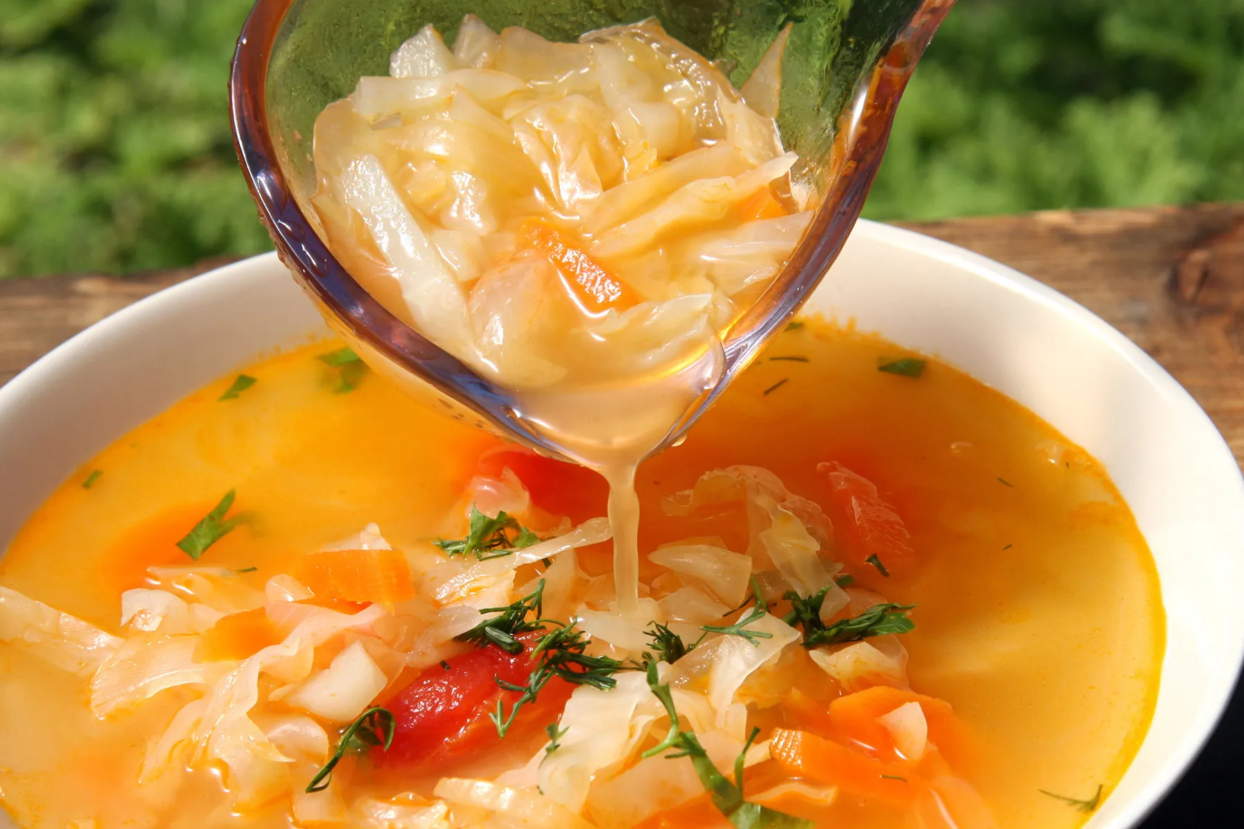 photo of pouring bowl of cabbage soup