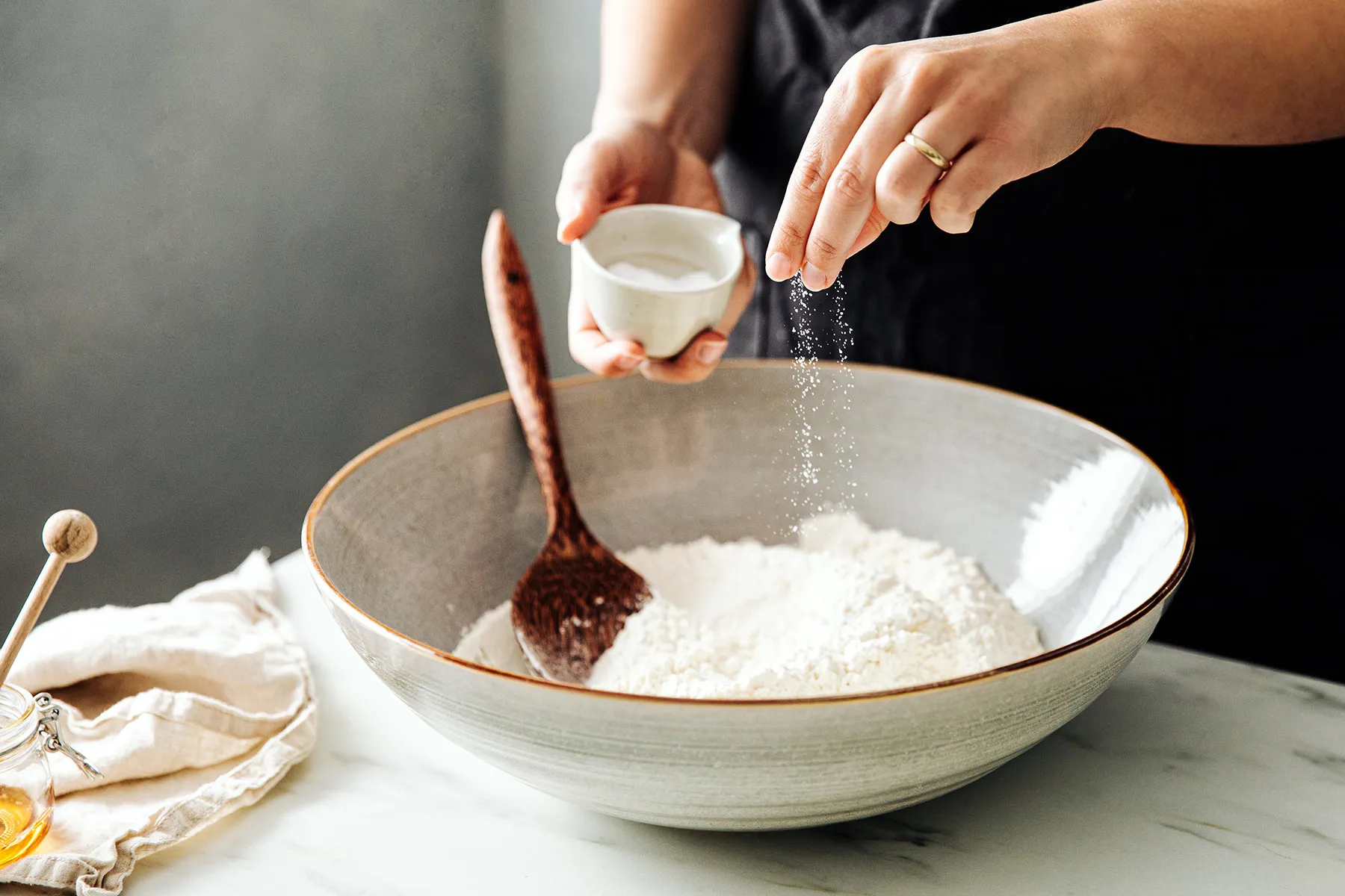 photo of sprinkling salt into flour