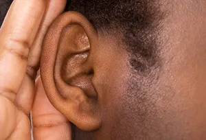hand cupped behind ear close up