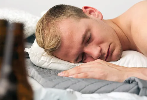man_sleeping in bed after drinking