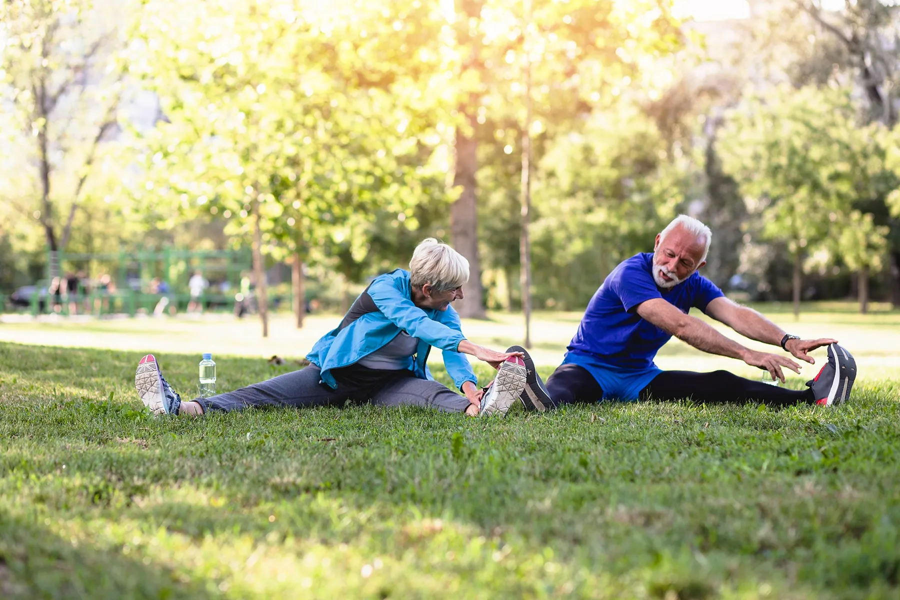 photo of mature couple stretching