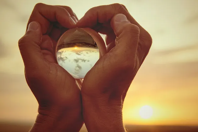 photo of glass ball reflecting serene scenery