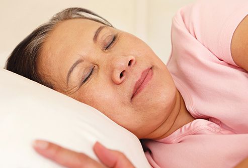 mature woman sleeping in bed