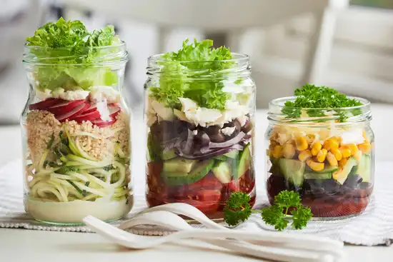photo of salads in mason jars