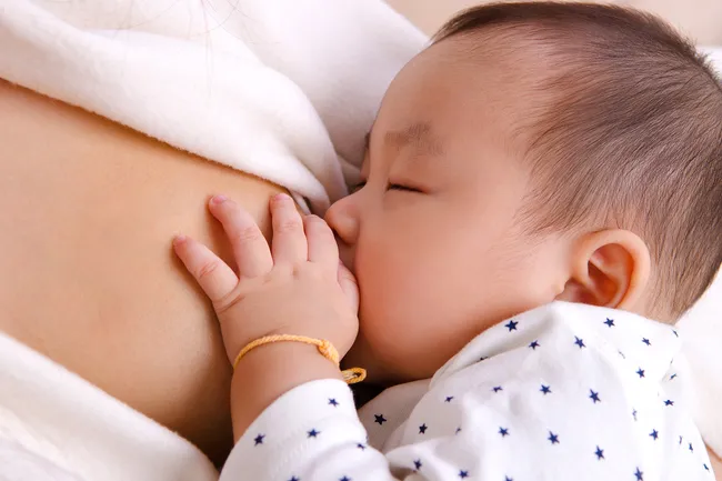 photo of child breastfeeding