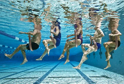 Five senior people in swimming pool