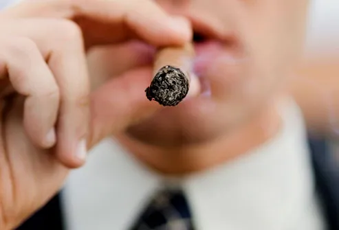 Close Up of Man Smoking Cigar