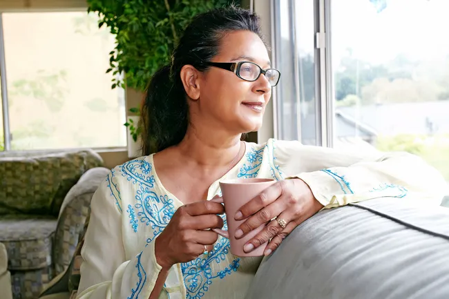 photo of woman drinking tea