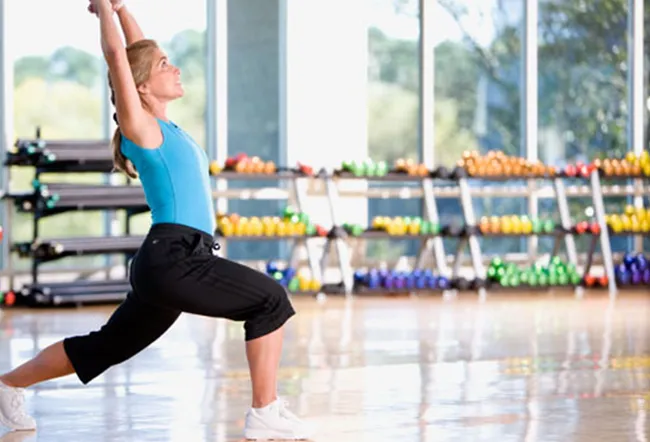 Woman stretching in exercise studio