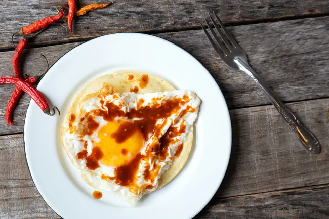 photo of egg and hot sauce