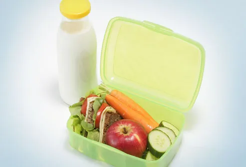 Healthy lunch box and bottle of milk 