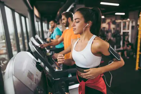 photo of people running on treadmills