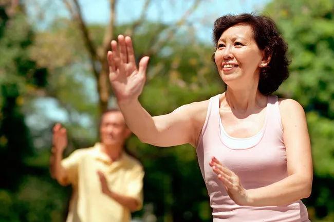 photo of couple practicing tai chi