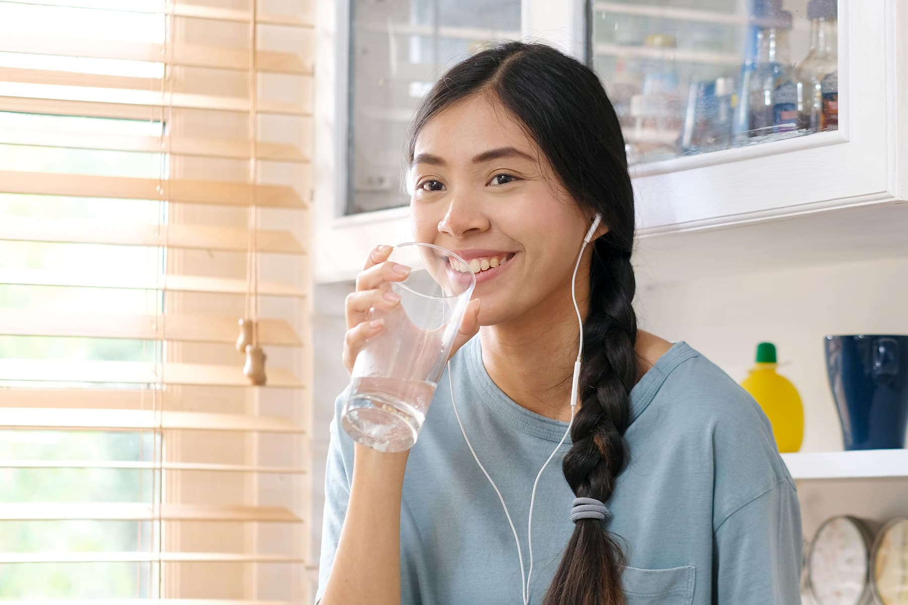 photo of teen drinking water