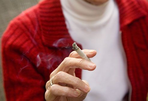 A cigarette in a woman's hand