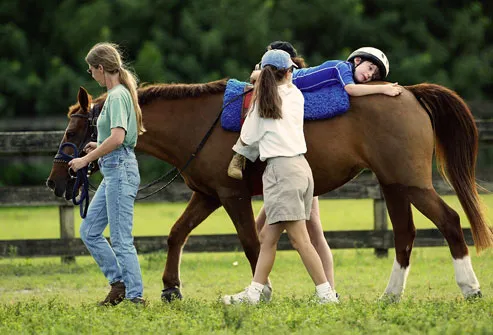 Horse therapy for autistic boy