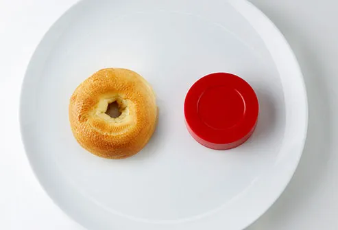 bagel and hockey puck on plate
