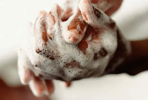 Close up of sudsy hands