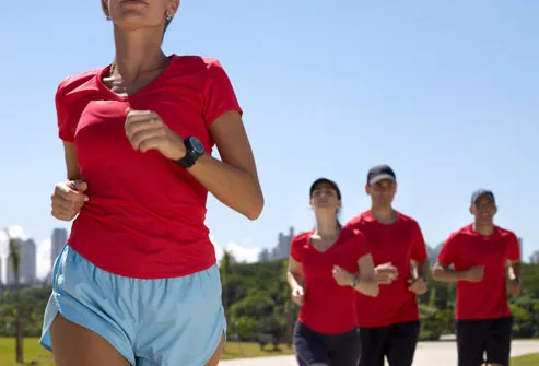 Group of men and women running